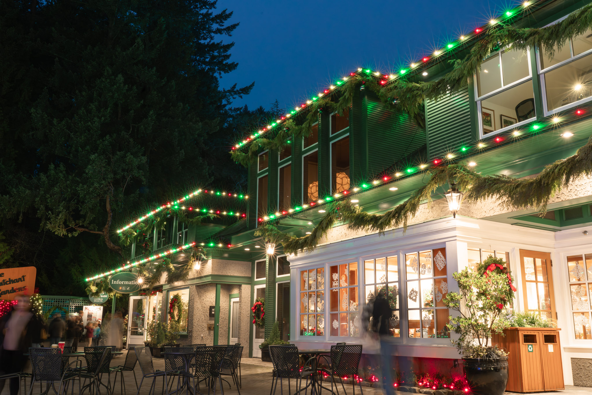 Commercial building with warm white roofline holiday lights